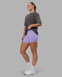 Woman wearing Heart FLXCotton Oversized Tee - Washed Dark Storm-Violet Ray | Model:Neve | Size:XS