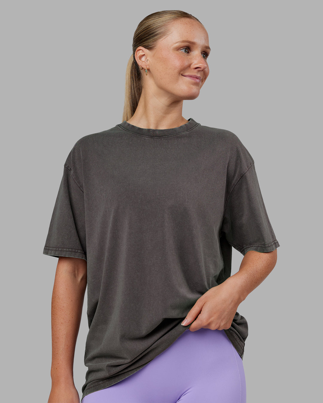 Woman wearing Heart FLXCotton Oversized Tee - Washed Dark Storm-Violet Ray | Model:Neve | Size:XS
