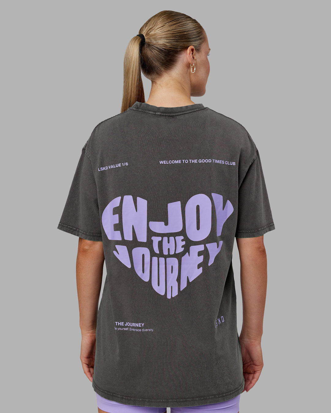 Woman wearing Heart FLXCotton Oversized Tee - Washed Dark Storm-Violet Ray | Model:Neve | Size:XS