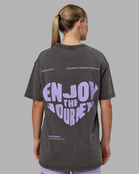 Woman wearing Heart FLXCotton Oversized Tee - Washed Dark Storm-Violet Ray | Model:Neve | Size:XS
