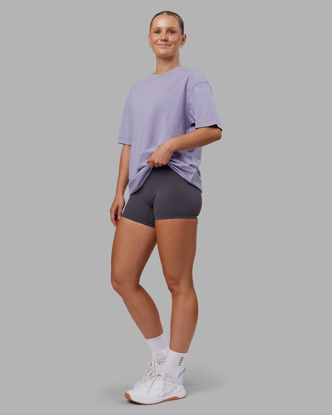 Woman wearing Heart FLXCotton Oversized Tee - Washed Violet Ray-White | Model:Neve | Size:XS