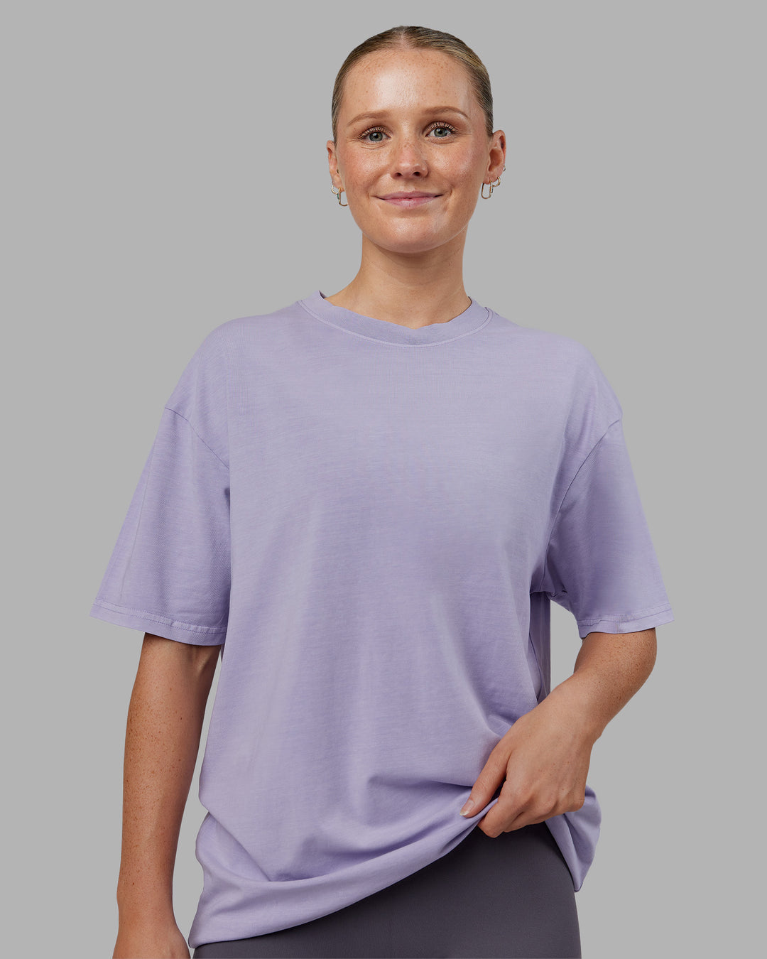 Woman wearing Heart FLXCotton Oversized Tee - Washed Violet Ray-White | Model:Neve | Size:XS