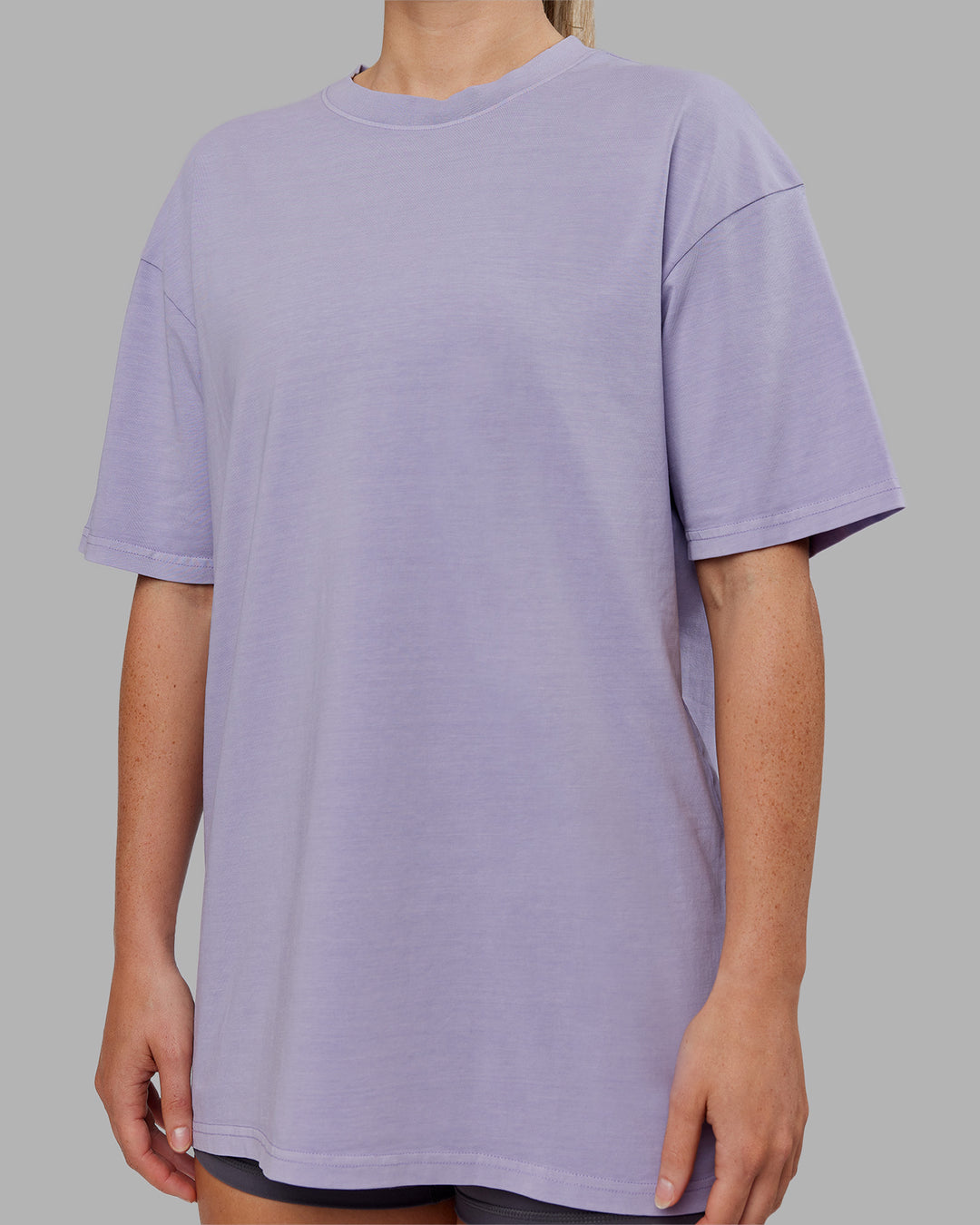 Woman wearing Heart FLXCotton Oversized Tee - Washed Violet Ray-White | Model:Neve | Size:XS