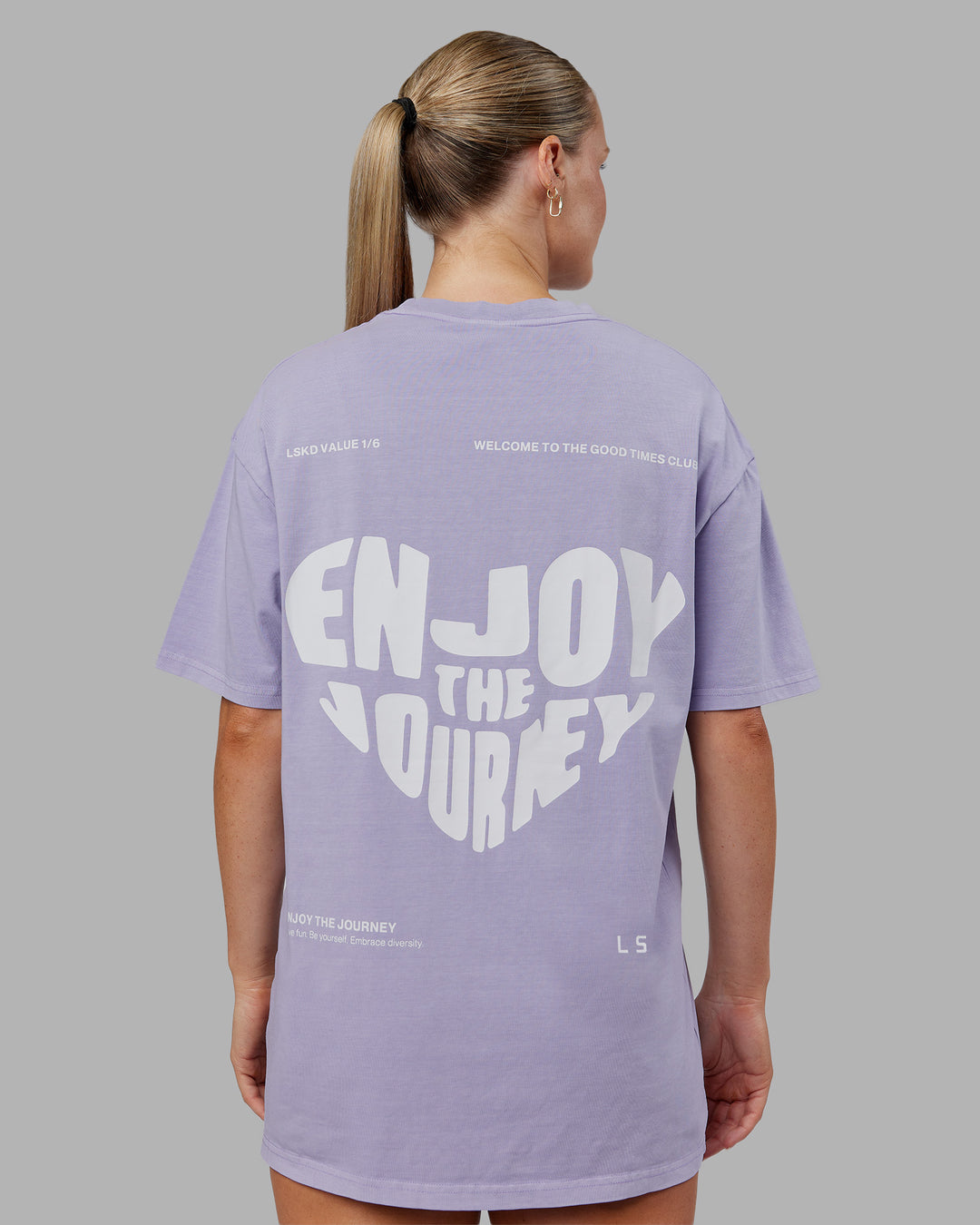 Woman wearing Heart FLXCotton Oversized Tee - Washed Violet Ray-White | Model:Neve | Size:XS