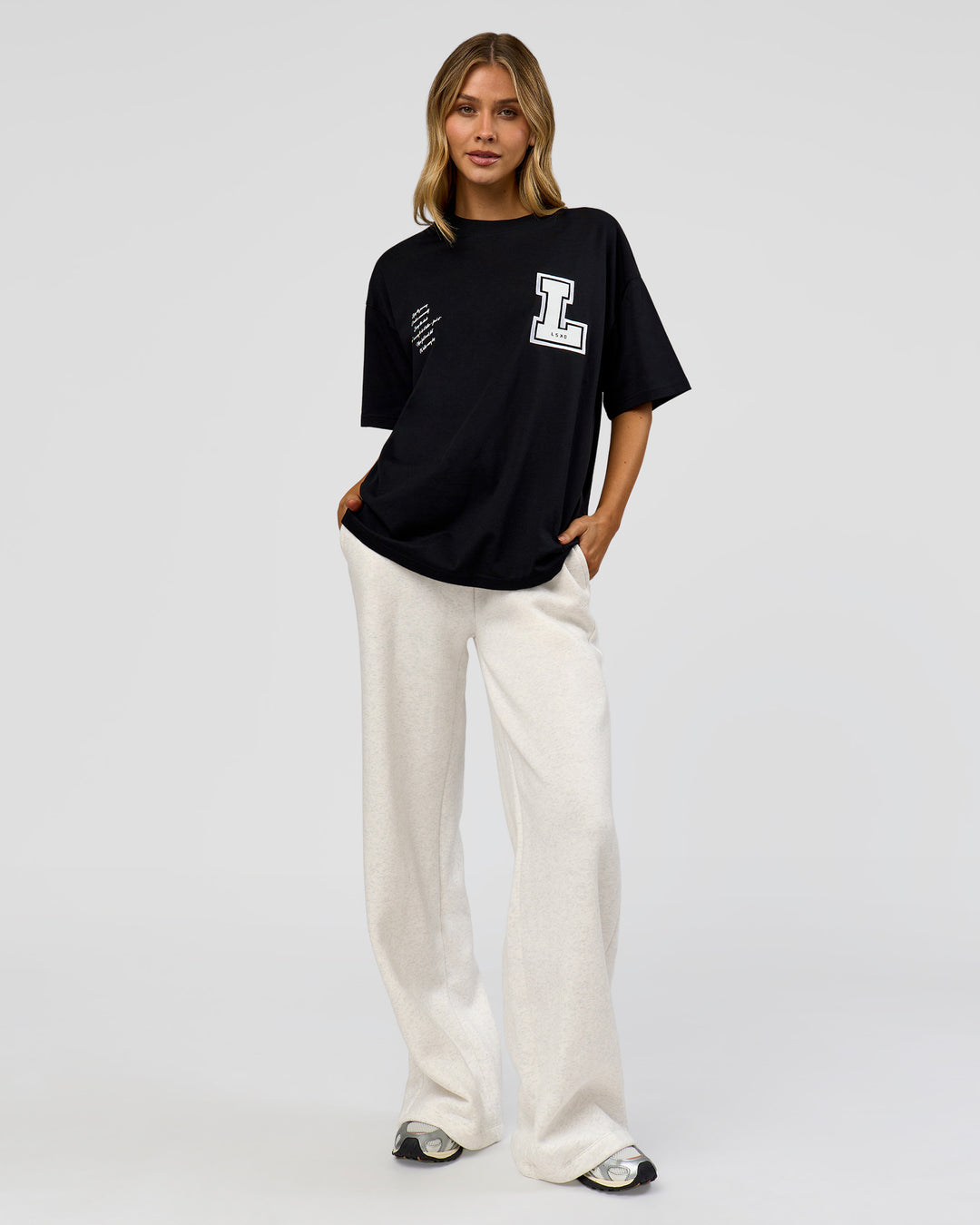 Woman wearing Hype Heavyweight Unisex Oversized Tee - Black-White | Model:Leilani | Size:XS - view 14