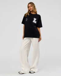 Woman wearing Hype Heavyweight Unisex Oversized Tee - Black-White | Model:Leilani | Size:XS | Thumbnail Index: 14
