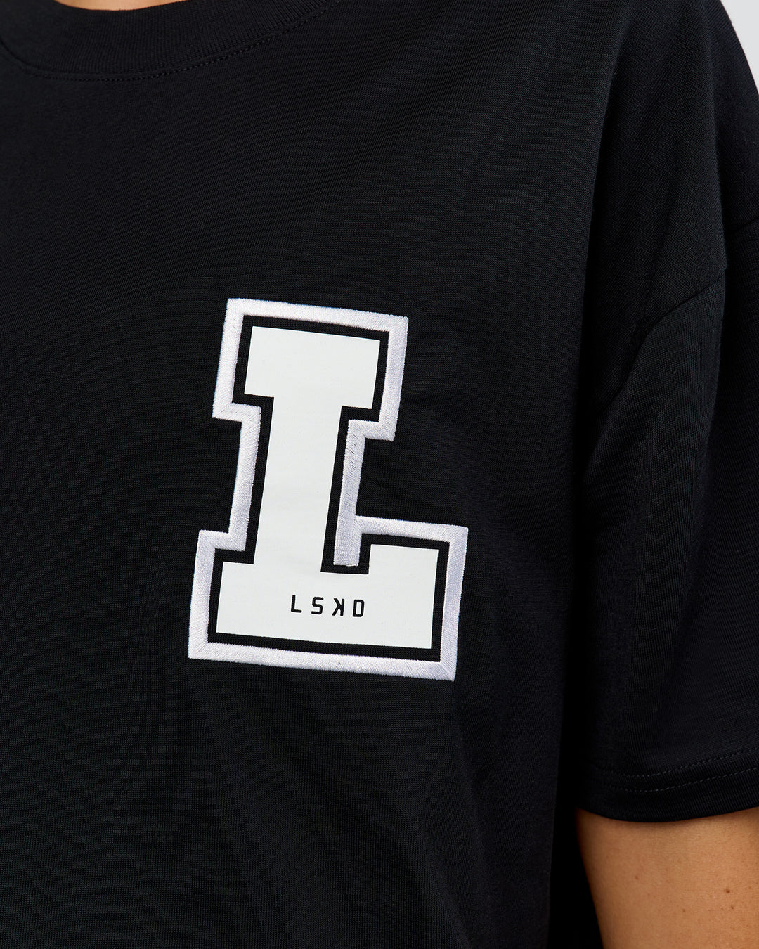 Woman wearing Hype Heavyweight Unisex Oversized Tee - Black-White | Model:Leilani | Size:XS - view 19