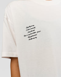 Woman wearing Hype Heavyweight Unisex Oversized Tee - Off White-Black | Model:Leilani | Size:XS