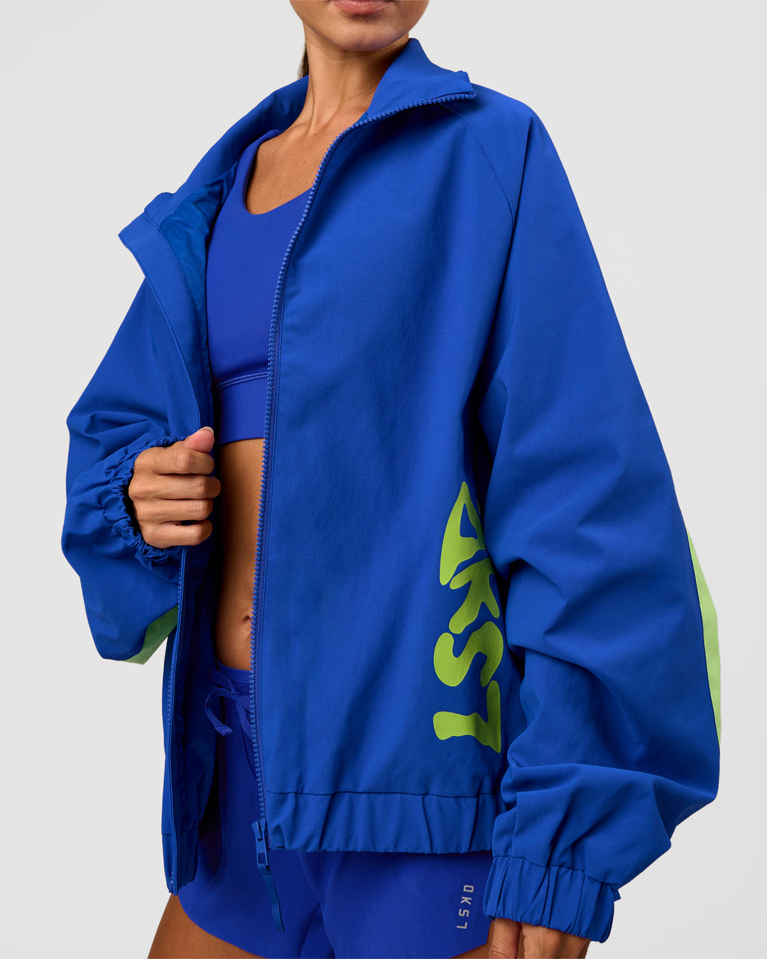 Woman wearing Hype Oversized Track Jacket - Electric Indigo | Model:Brylee | Size:XS