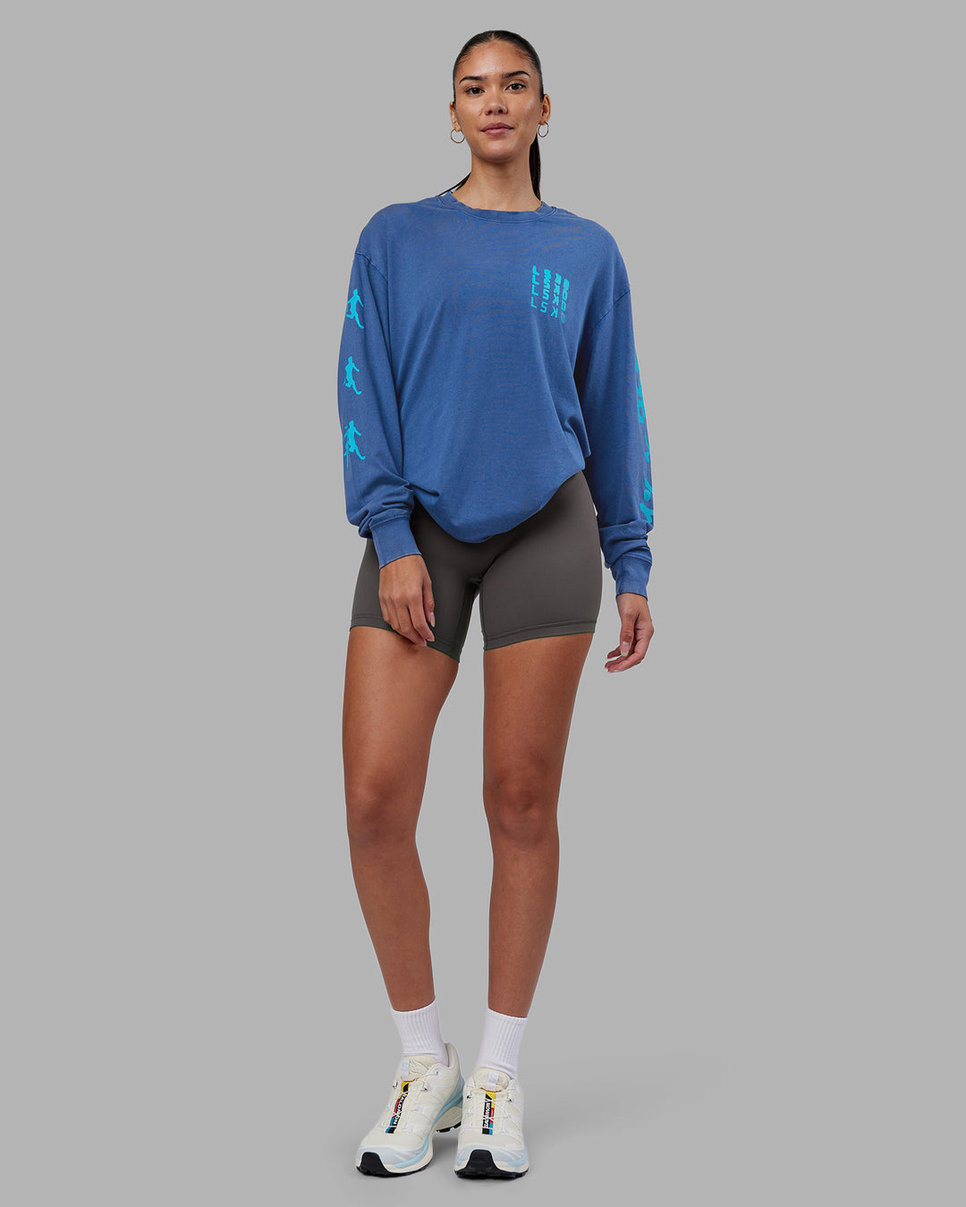 Woman wearing Inferno Journey FLXCotton Oversized Long Sleeve Tee - Midnight Blue-Blue Bird | Model:Rhiley | Size:XS