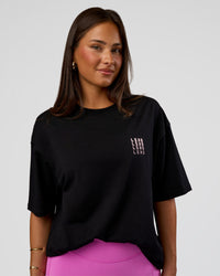 Woman wearing Inferno Journey FLXCotton Oversized Tee - Black-Ultra Fuchsia | Model:Bianca | Size:XS