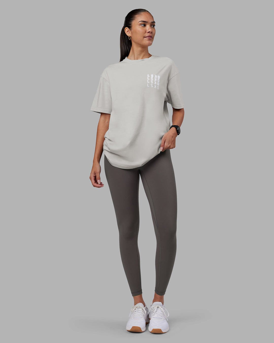 Woman wearing Inferno Journey FLXCotton Oversized Tee - Digital Mist Washed-White | Model:Rhiley | Size:XS
