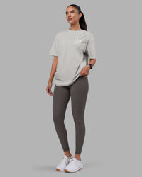 Woman wearing Inferno Journey FLXCotton Oversized Tee - Digital Mist Washed-White | Model:Rhiley | Size:XS