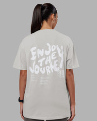 Woman wearing Inferno Journey FLXCotton Oversized Tee - Digital Mist Washed-White | Model:Rhiley | Size:XS