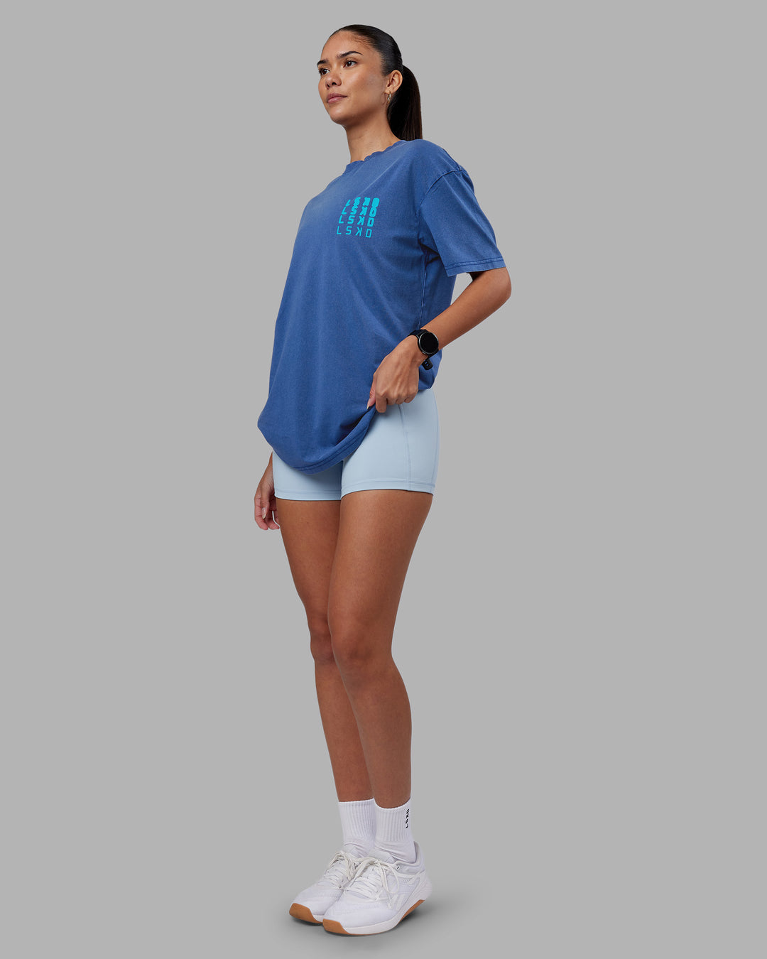 Woman wearing Inferno Journey FLXCotton Oversized Tee - Midnight Blue Washed-Blue | Model:Rhiley | Size:XS