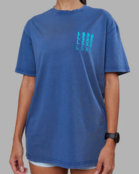 Woman wearing Inferno Journey FLXCotton Oversized Tee - Midnight Blue Washed-Blue | Model:Rhiley | Size:XS