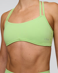 Woman wearing Interstellar Sports Bra - Solar Lime | Model:Emelia | Size:XS | Thumbnail Index: 5