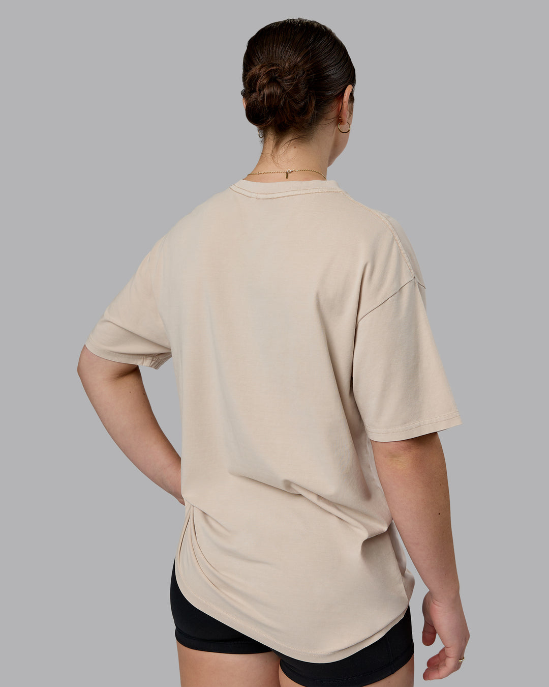 Woman wearing Journey FLXCotton Oversized Tee in Washed Shale-Beige Dark-Moss | Model:Sav | Size:XS