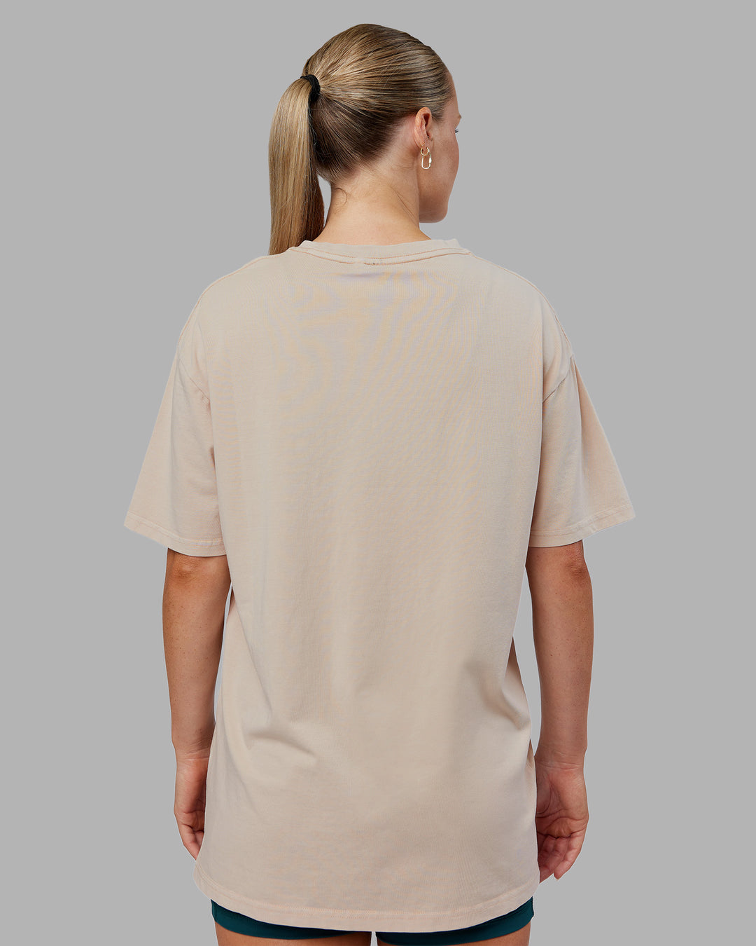 Woman wearing Journey FLXCotton Oversized Tee - Washed Shale Beige-Dark Moss| Model:Neve | Size:XS