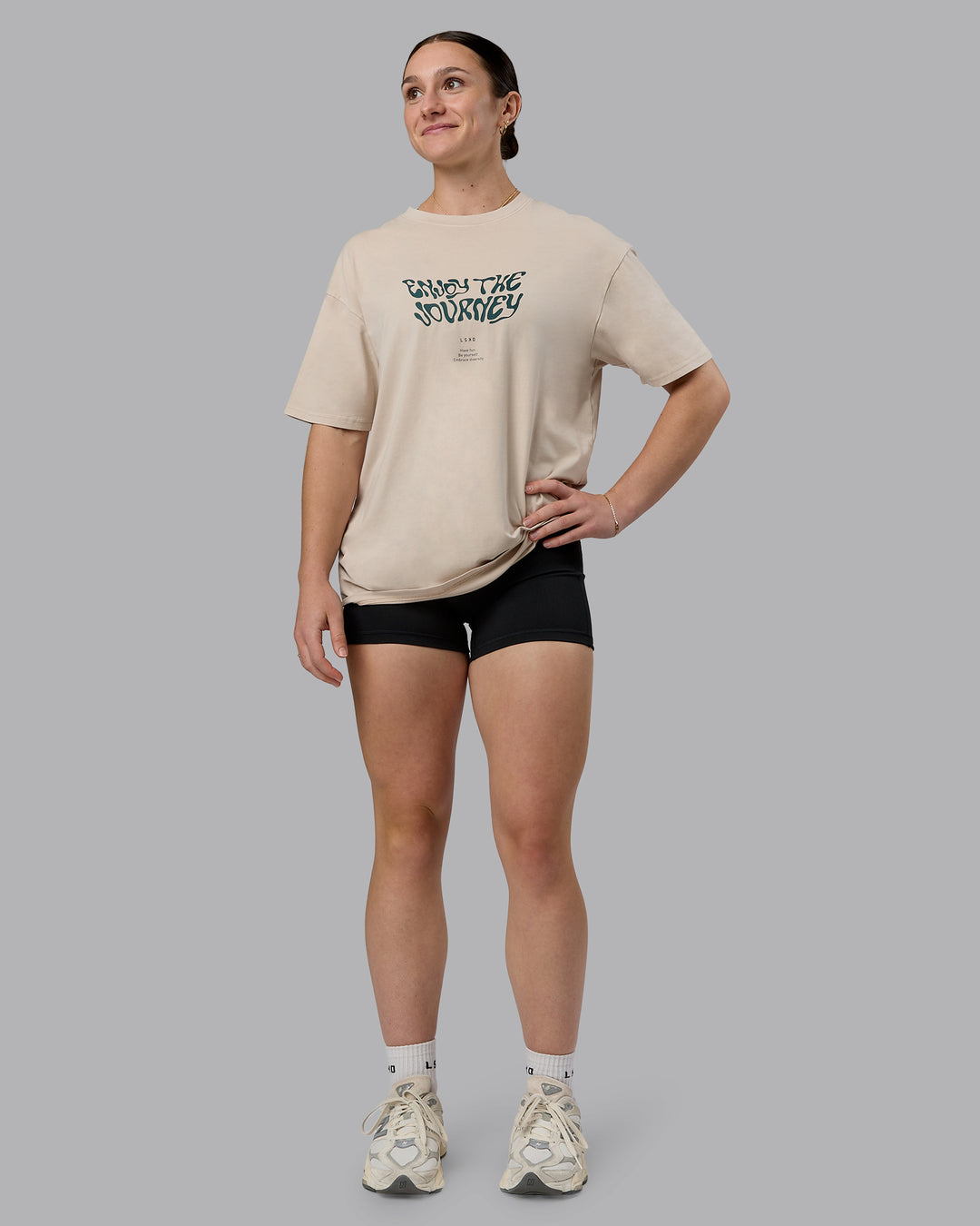 Woman wearing Journey FLXCotton Oversized Tee in Washed Shale-Beige Dark-Moss | Model:Sav | Size:XS