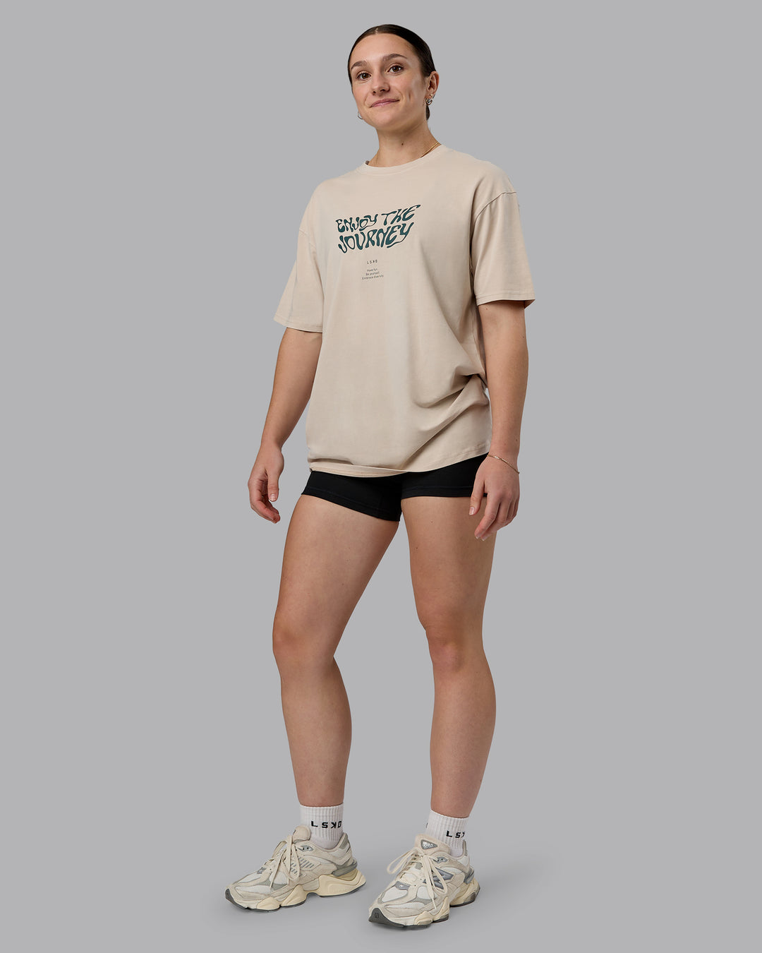 Woman wearing Journey FLXCotton Oversized Tee in Washed Shale-Beige Dark-Moss | Model:Sav | Size:XS