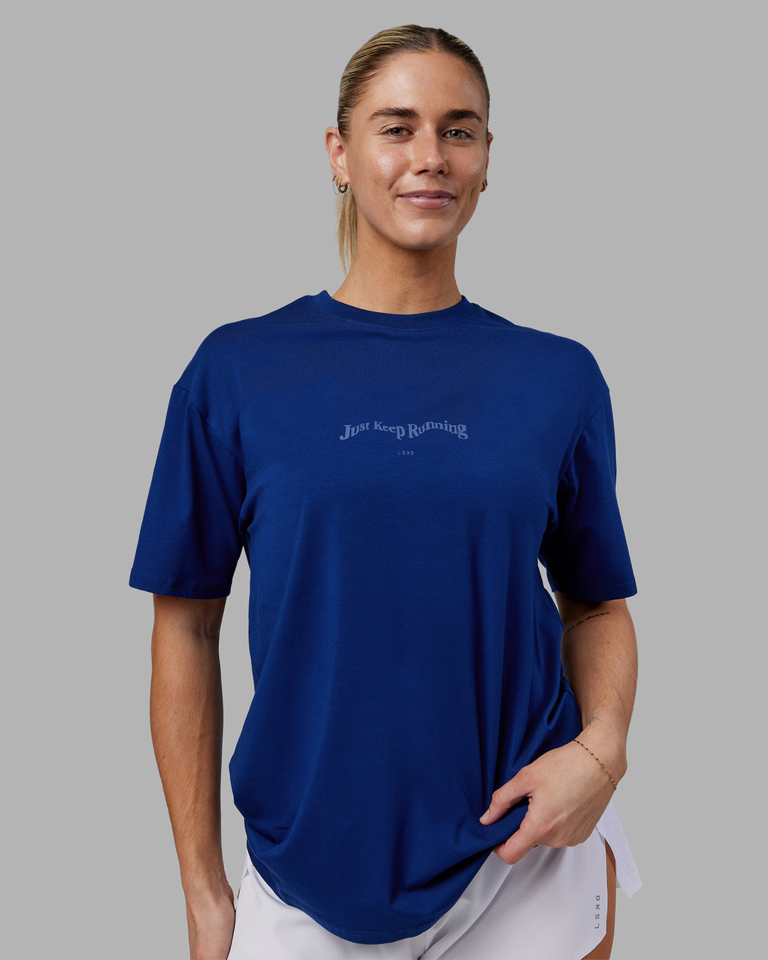 Woman wearing Just Run FLXCotton Oversized Tee - Midnight Blue-Light Blue | Model:Hannah | Size:XS