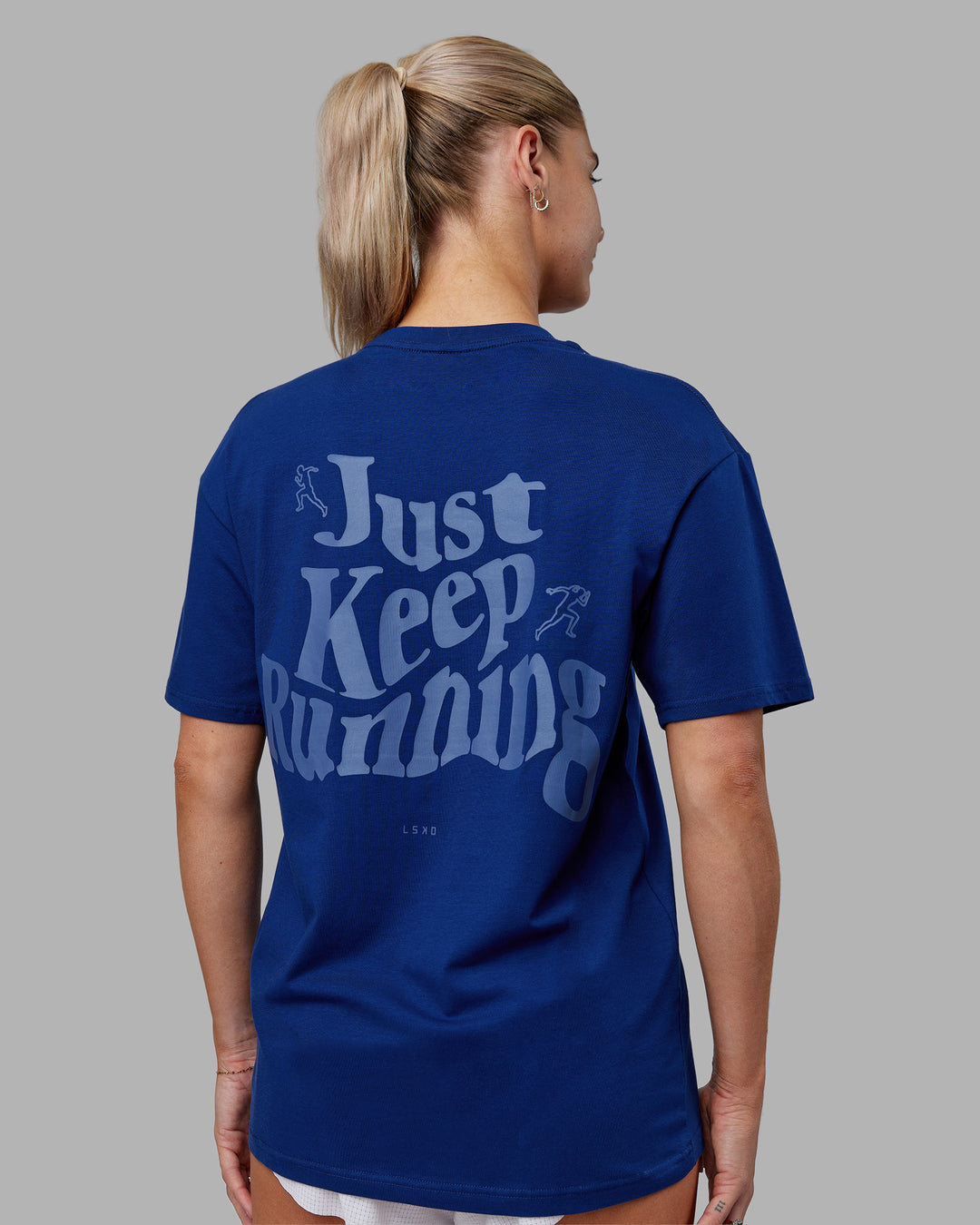 Woman wearing Just Run FLXCotton Oversized Tee - Midnight Blue-Light Blue | Model:Hannah | Size:XS
