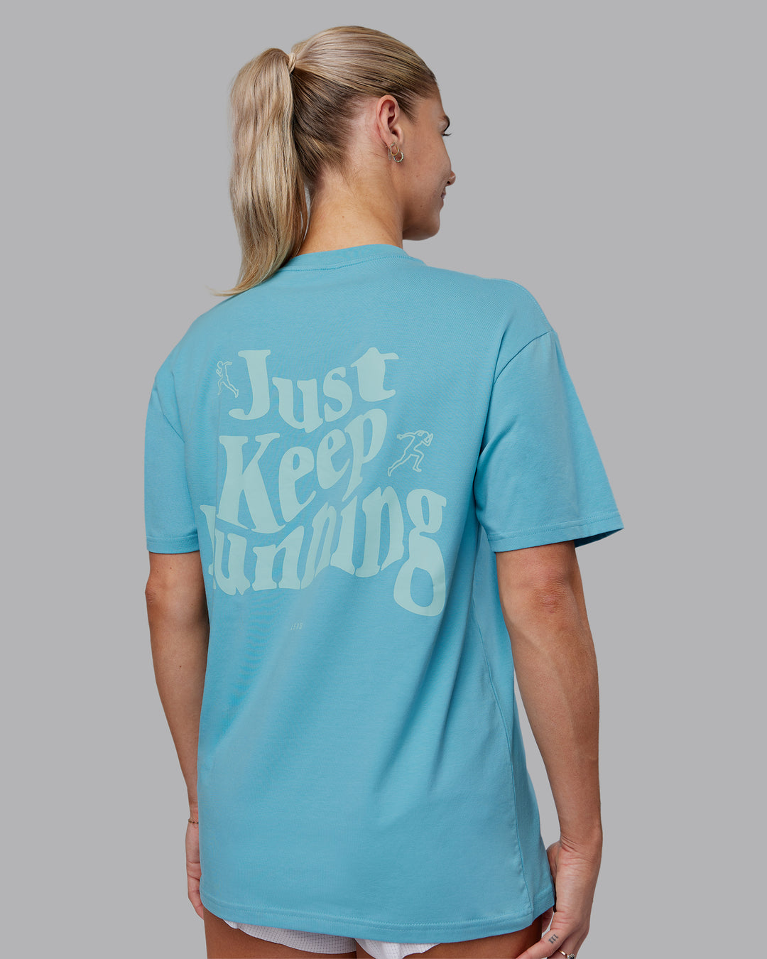 Woman wearing Just Run FLXCotton Oversized Tee - Retro Blue-Light Retro Blue | Model:Hannah | Size:XS