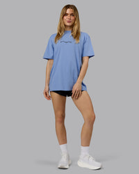 Woman wearing Just Run FLXCotton Oversized Tee - Soft Blue-Dark Storm | Model:Emilie | Size:XS