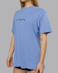 Woman wearing Just Run FLXCotton Oversized Tee - Soft Blue-Dark Storm | Model:Emilie | Size:XS