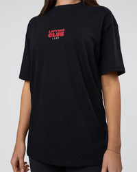 Woman wearing Kettle B FLXCotton Oversized Tee - Black-White | Model:Estella | Size:XS