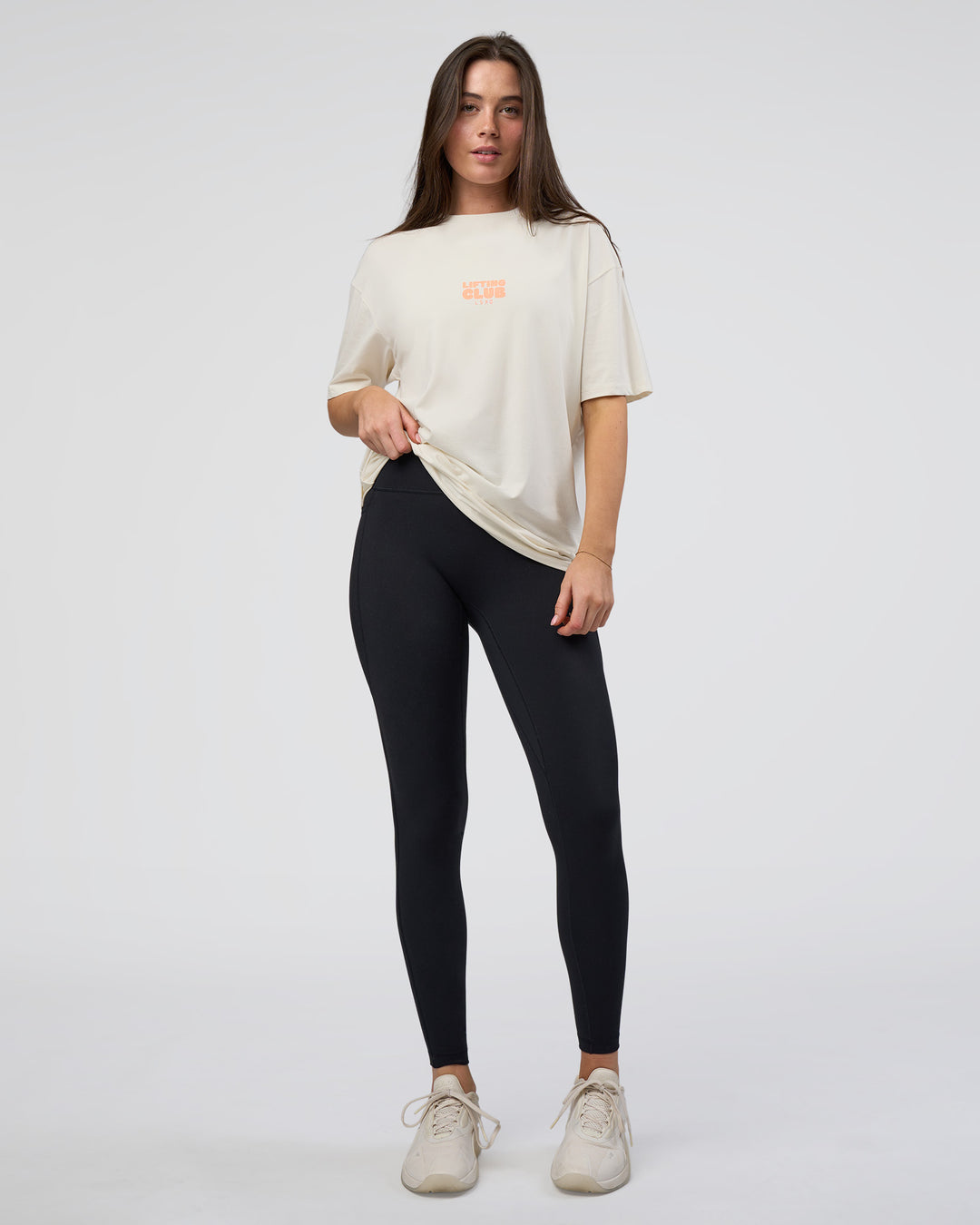 Woman wearing Kettle B FLXCotton Oversized Tee - Sugar Swizzle-Cantaloupe | Model:Estella | Size:XS