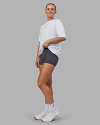 Woman wearing Kettlebell FLXCotton Oversized Tee - White-Black | Model:Neve | Size:XS