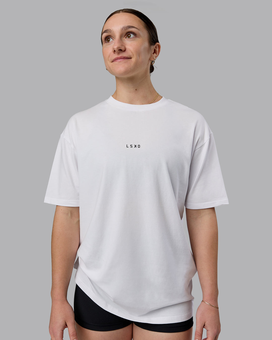 Woman wearing Kettlebell Oversized Tee - White-Black | Model:Sav | Size:XS