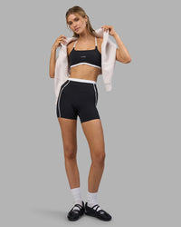 Woman wearing Liberate Contrast High-Rise 4" Short Pockets - Black-White | Model:Leilani | Size:XS | Thumbnail Index: 3