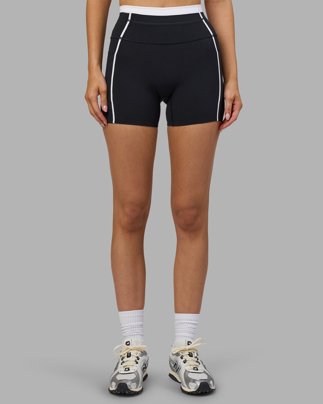Woman wearing Liberate Contrast High-Rise 4" Short Pockets - Black-White | Model:Leilani | Size:XS - view 2