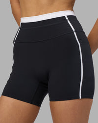 Woman wearing Liberate Contrast High-Rise 4" Short Pockets - Black-White | Model:Leilani | Size:XS | Thumbnail Index: 2
