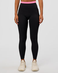 Woman wearing Liberate High-Rise Full Length Legging Pockets - Black-Candy Pink | Model:Brylee | Size:XS