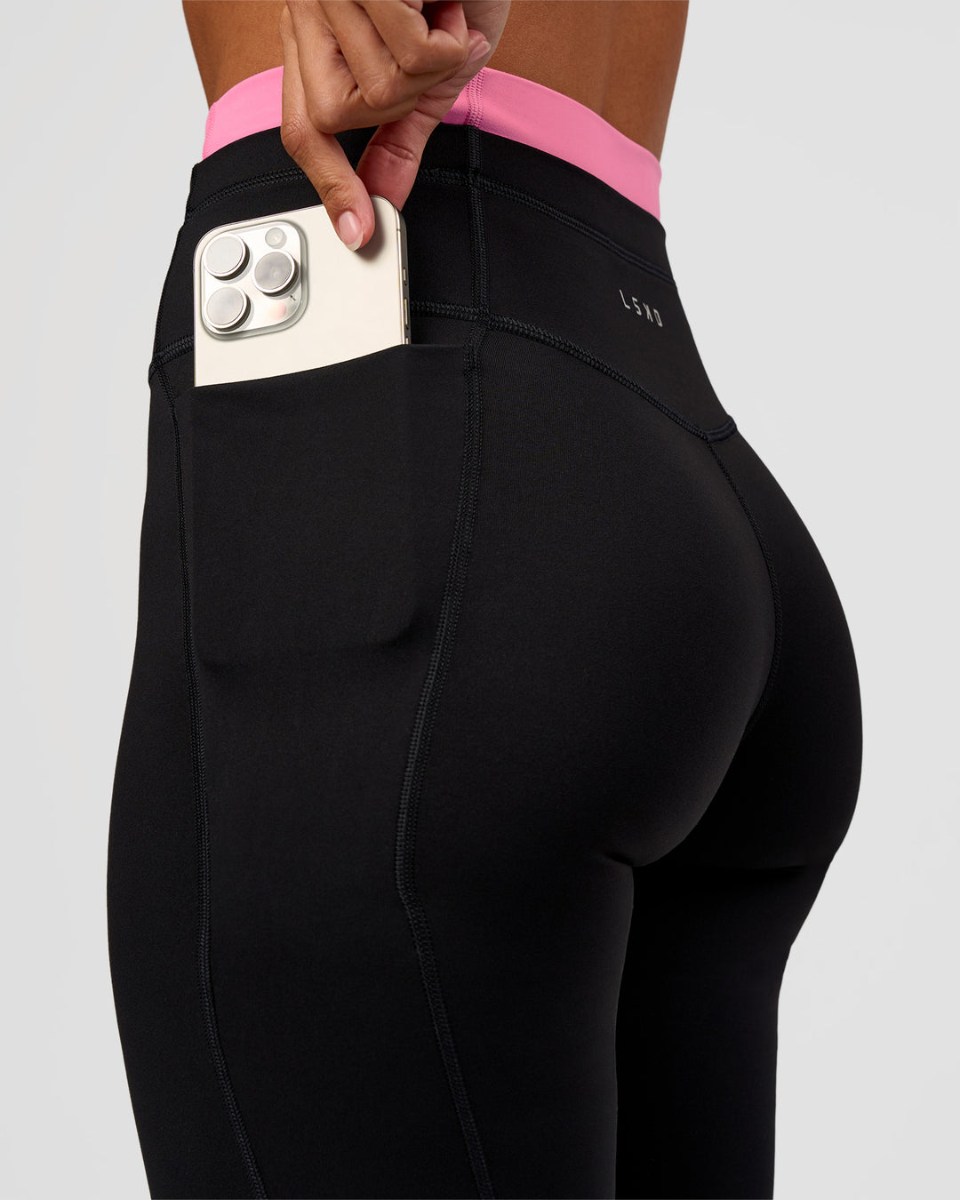 Woman wearing Liberate High-Rise Full Length Legging Pockets - Black-Candy Pink | Model:Brylee | Size:XS
