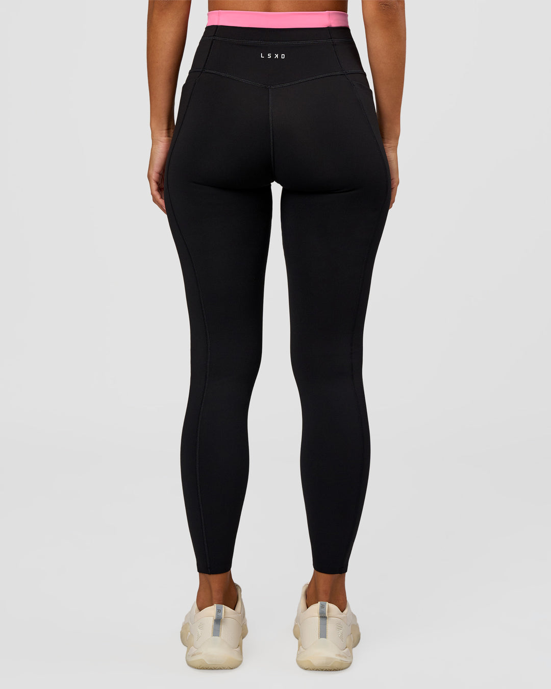 Woman wearing Liberate High-Rise Full Length Legging Pockets - Black-Candy Pink | Model:Brylee | Size:XS