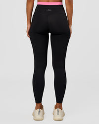 Woman wearing Liberate High-Rise Full Length Legging Pockets - Black-Candy Pink | Model:Brylee | Size:XS