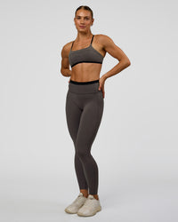 Woman wearing Liberate High-Rise Full Length Legging Pockets in Duskstone-Black | Model:Maja | Size:XS