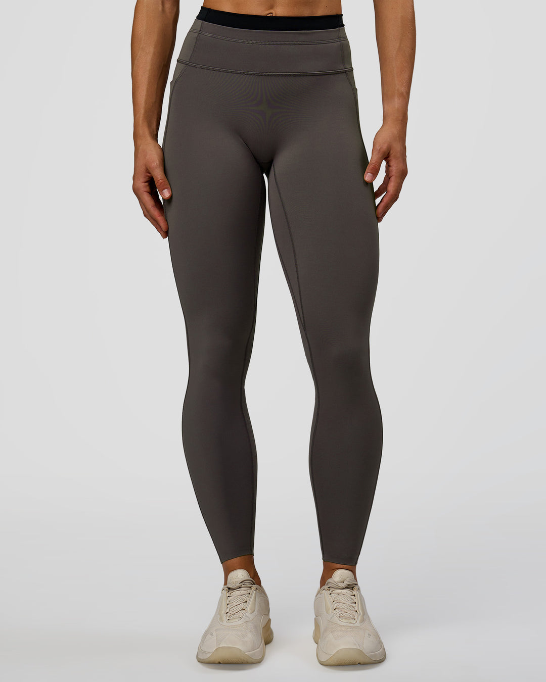 Woman wearing Liberate High-Rise Full Length Legging Pockets in Duskstone-Black | Model:Maja | Size:XS