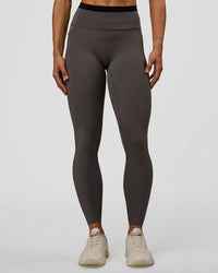 Woman wearing Liberate High-Rise Full Length Legging Pockets in Duskstone-Black | Model:Maja | Size:XS