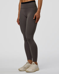 Woman wearing Liberate High-Rise Full Length Legging Pockets in Duskstone-Black | Model:Maja | Size:XS