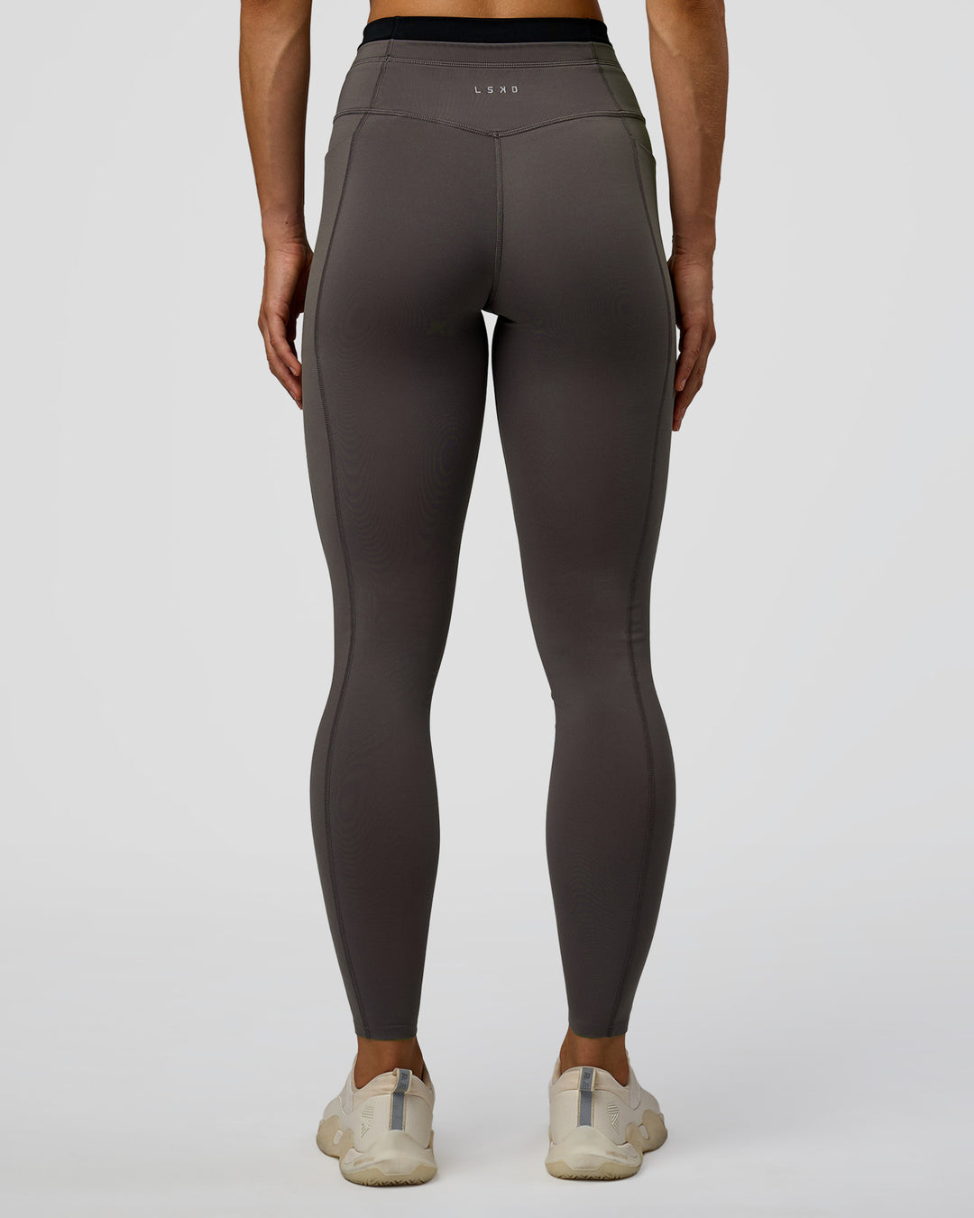 Woman wearing Liberate High-Rise Full Length Legging Pockets in Duskstone-Black | Model:Maja | Size:XS