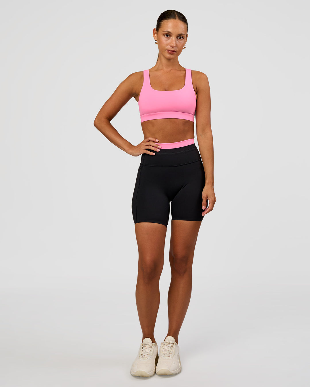 Woman wearing Liberate High-Rise 6" Short Pockets - Black-Candy Pink | Model:Brylee | Size:XS - view 3