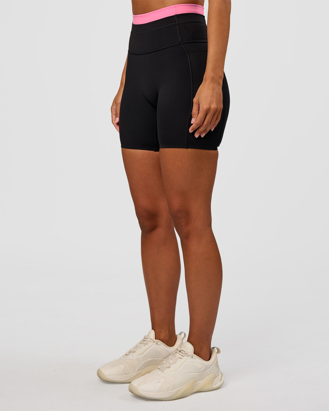 Woman wearing Liberate High-Rise 6" Short Pockets - Black-Candy Pink | Model:Brylee | Size:XS - view 6