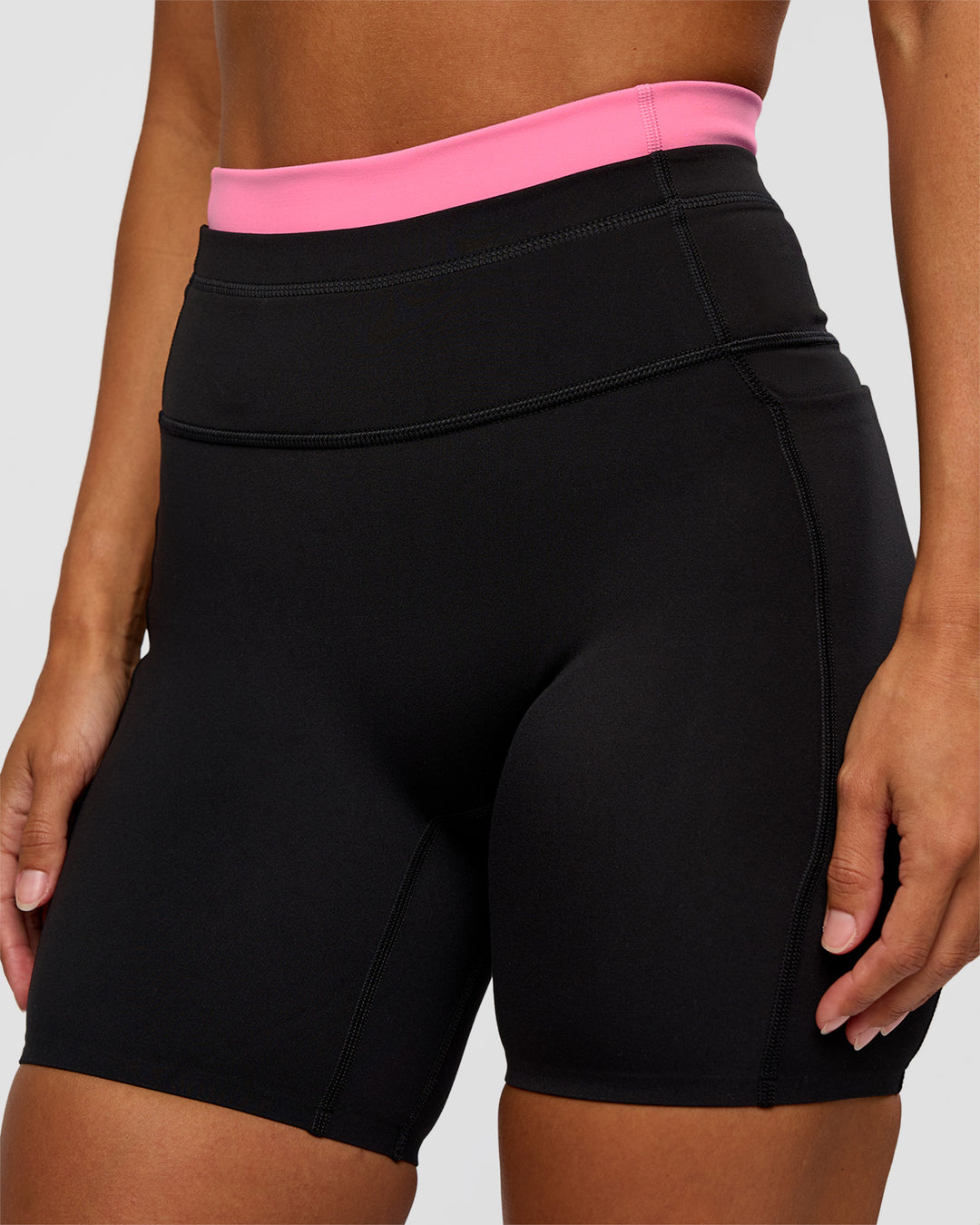 Woman wearing Liberate High-Rise 6" Short Pockets - Black-Candy Pink | Model:Brylee | Size:XS - view 7