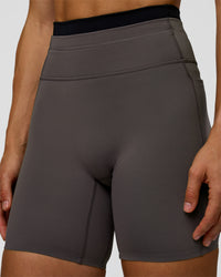 Woman wearing Liberate High-Rise 6" Short Pockets in Duskstone-Black | Model:Maja | Size:XS